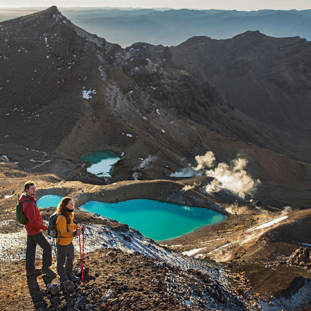 Trampers taking in the scenic view on the Tongariro Alpine Crossing