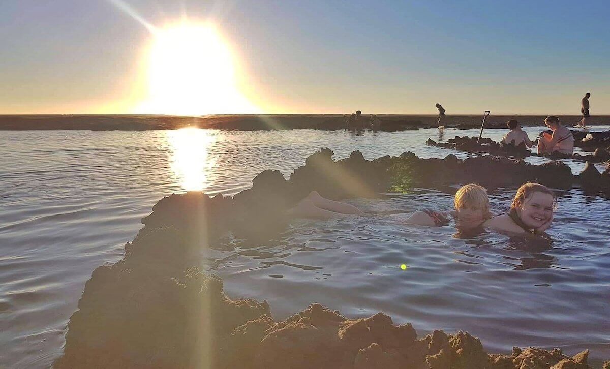 Families enjoying Hotwater beach, Kawhia