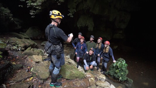 Photograph of a Down to Earth guide taking a photo of a tour group